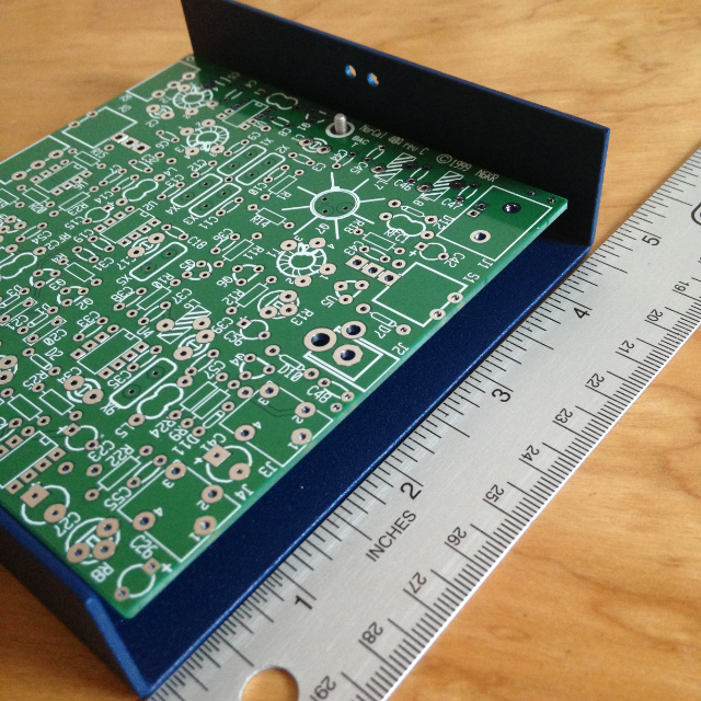 Viewing the NorCal 40A from the side with a ruler next to the case.