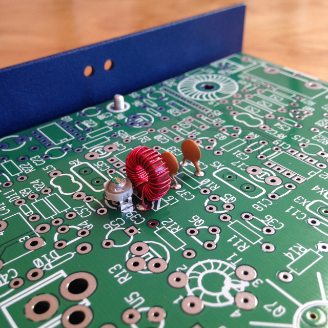 A close up of the inductor on the NorCal 40A circuit board. There's a bump on the top where the wire doesn't lay flat and the turns aren't spaced evenly. The real world is a messy, imperfect, and beautiful place.