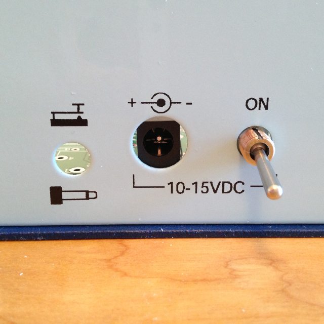A view of back panel of the NorCal 40A transceiver, showing off the DC power jack and on/off switch.